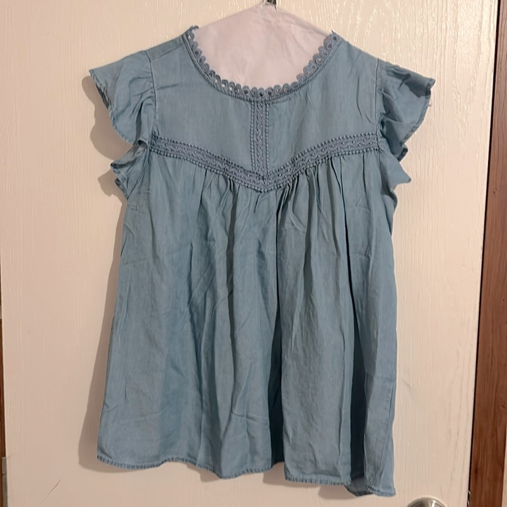 Beautiful Blue Blouse with Ruffle Sleeves. Size M. Never been worn. 100% Lyocell